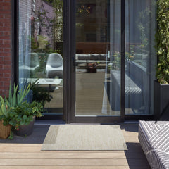 Nourison Essentials Area Rug 2' x 4' Ivory Beige on patio