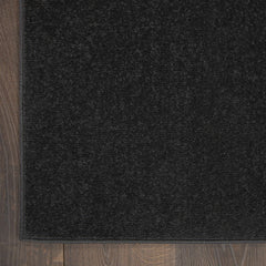 Nourison Essentials Black Runner Rug near a doorway