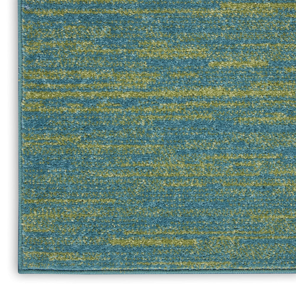 Nourison Essentials Blue Green rug with furniture