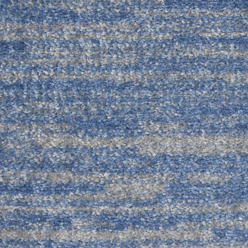 Nourison Essentials Blue Grey Area Rug in dining area