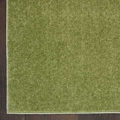 Nourison Essentials Green Area Rug 2' x 6' on patio