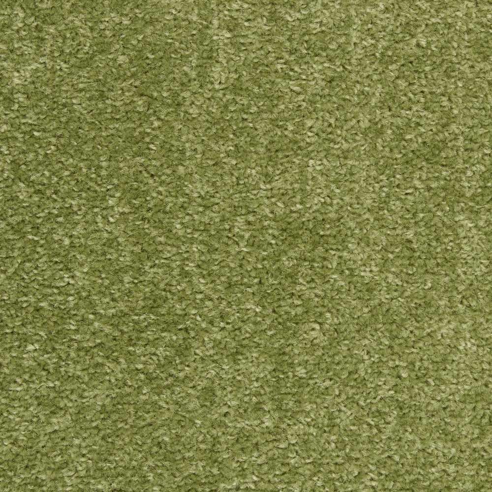 Nourison Essentials Green Area Rug on patio