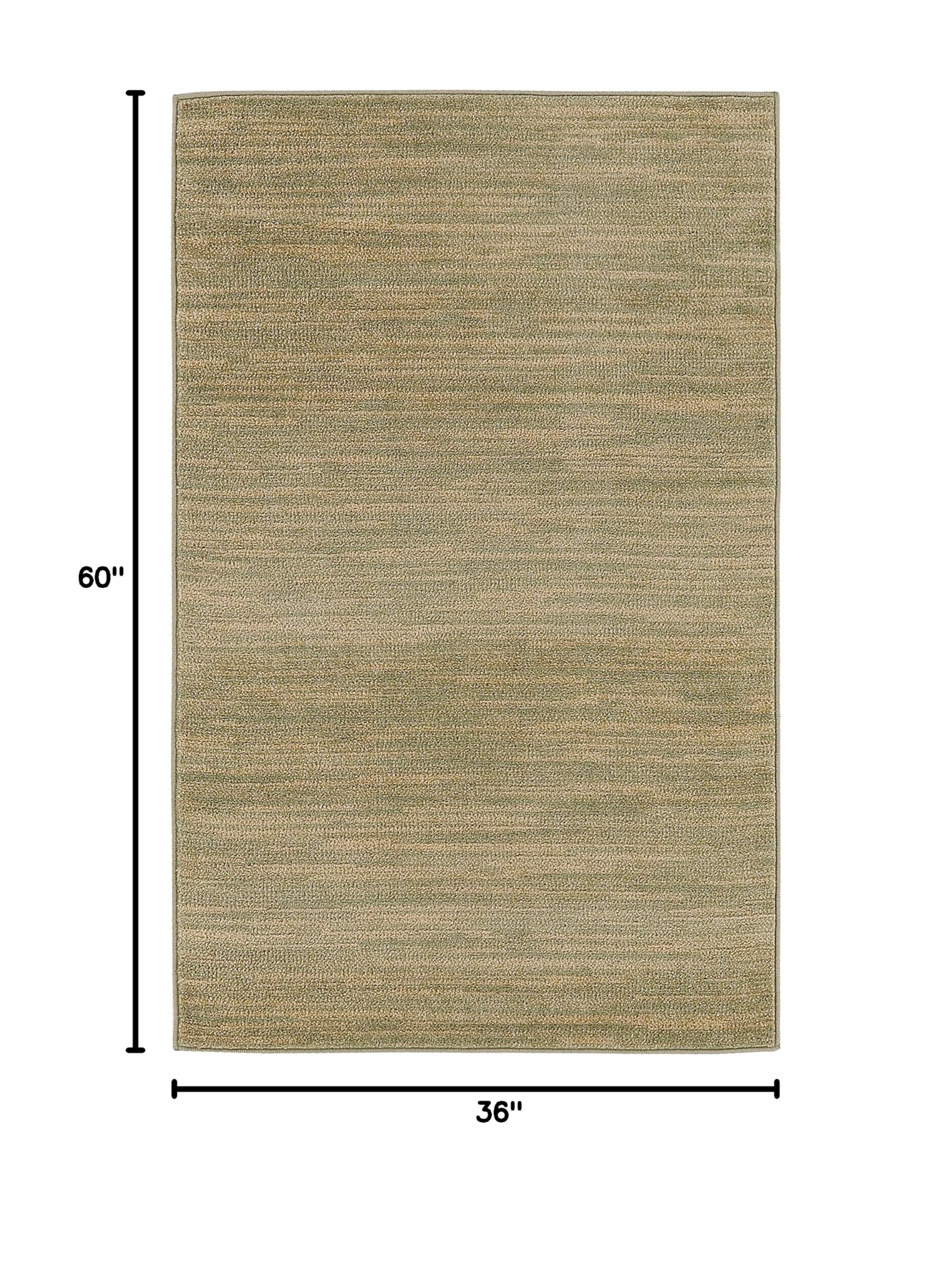 Nourison Essentials Green Gold Area Rug on patio