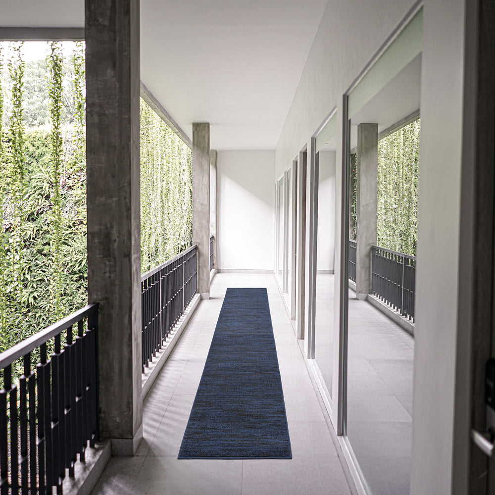 Nourison Essentials Midnight Blue 2'2" x 14' rug in outdoor setting