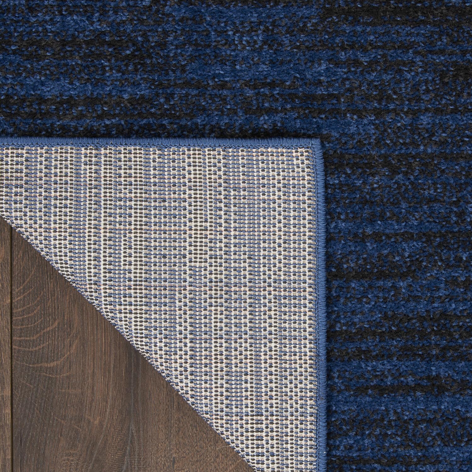 Nourison Essentials Midnight Blue Area Rug in living room