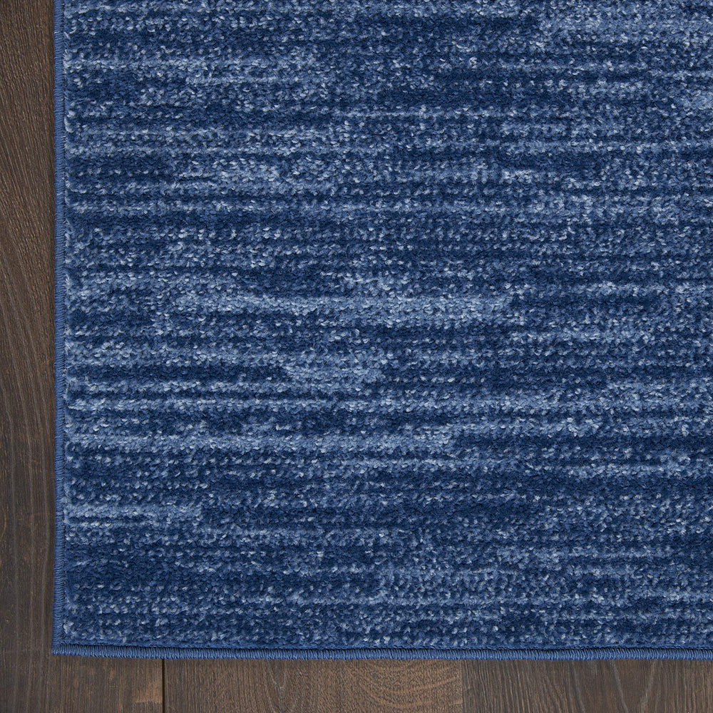 Nourison Essentials Navy Blue Area Rug 3' x 5' in living room setting