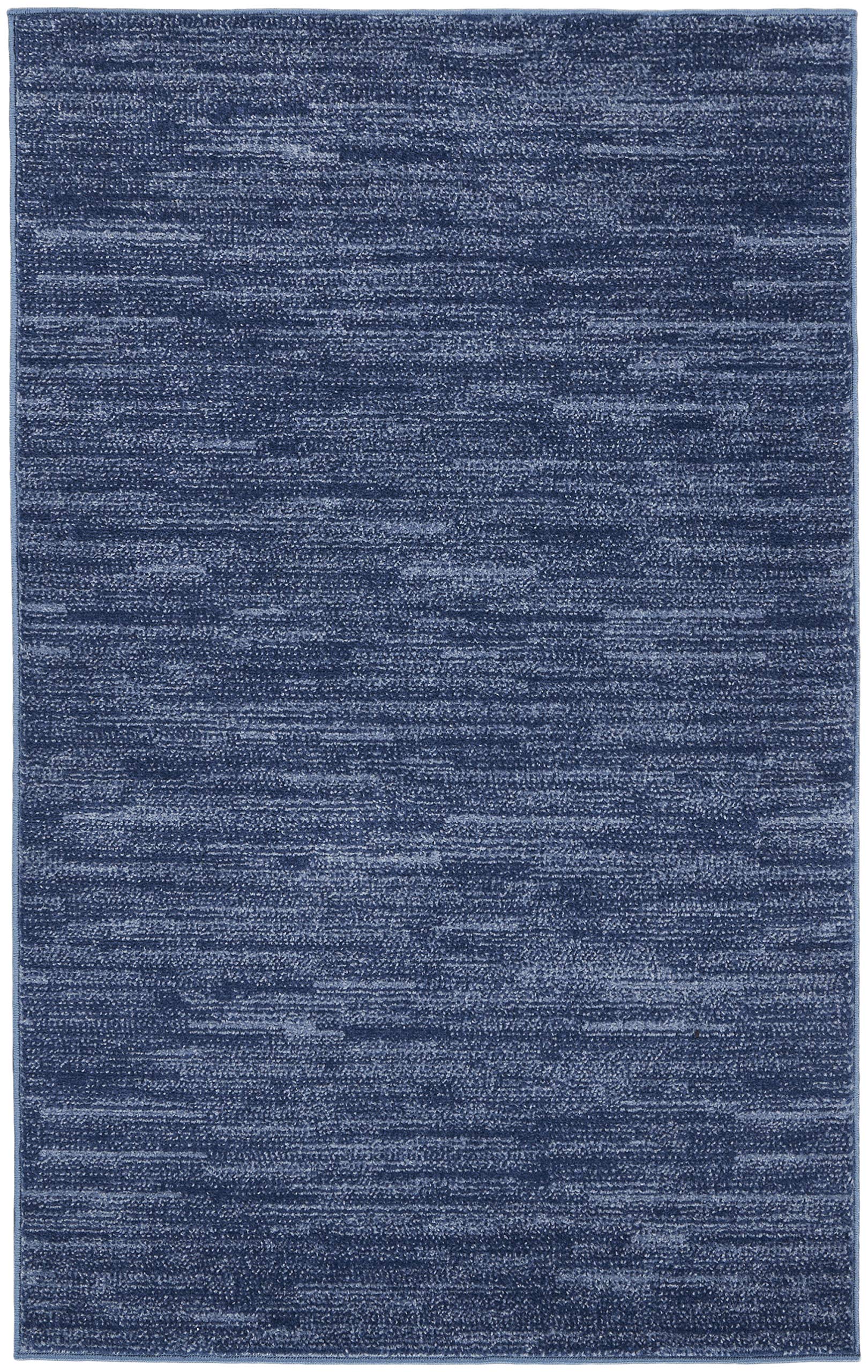 Nourison Essentials Navy Blue Area Rug 3' x 5' on patio