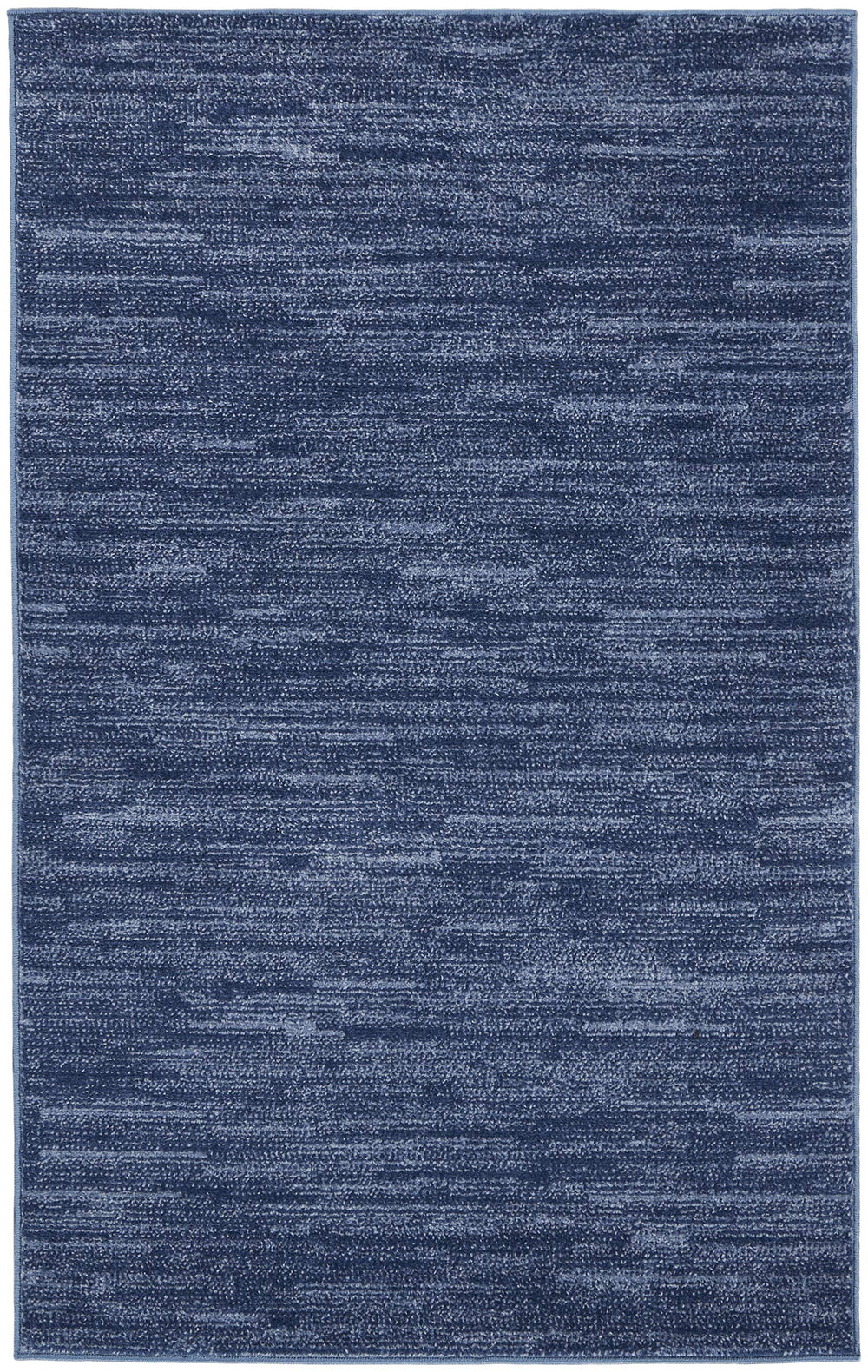 Nourison Essentials Navy Blue Area Rug 3' x 5' on patio