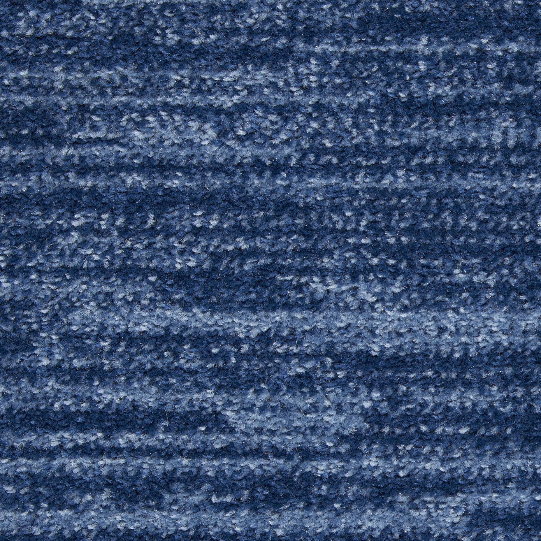 Nourison Essentials Navy Blue Rug in a dining area