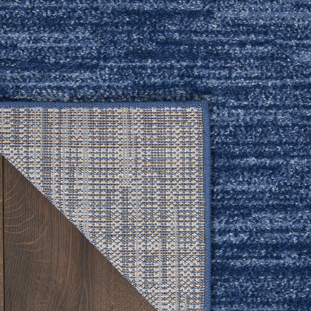 Nourison Essentials Navy Blue Rug in a living room setting