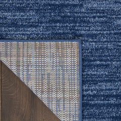 Nourison Essentials Navy Blue Rug in a living room setting