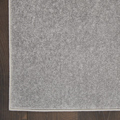 Nourison Essentials Outdoor Rug 2' x 6' on patio