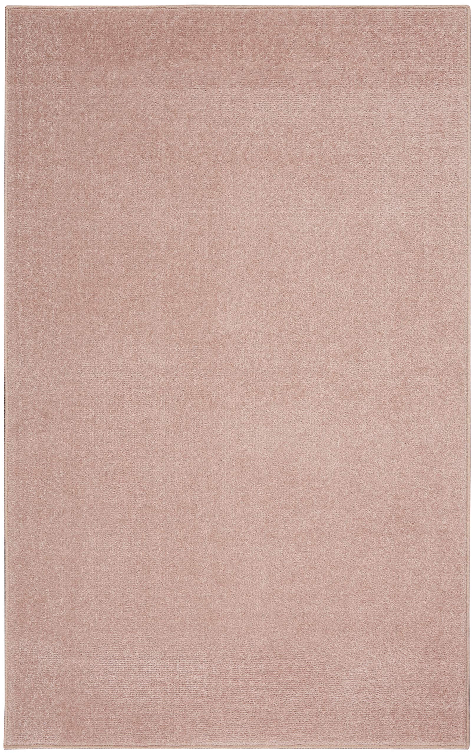 Nourison Essentials Pink Area Rug in living room