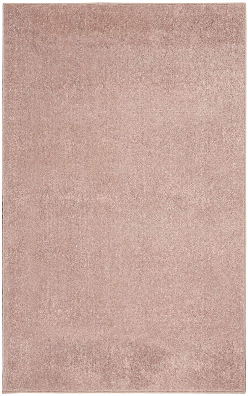 Nourison Essentials Pink Area Rug in living room