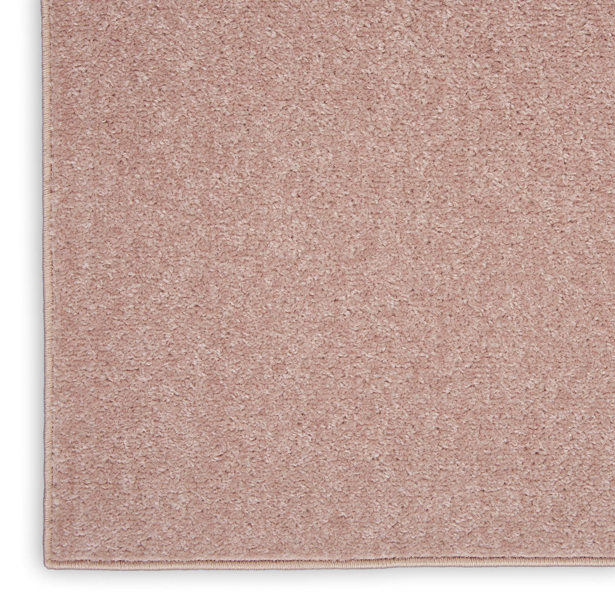 Nourison Essentials Pink Outdoor Rug showing low pile design