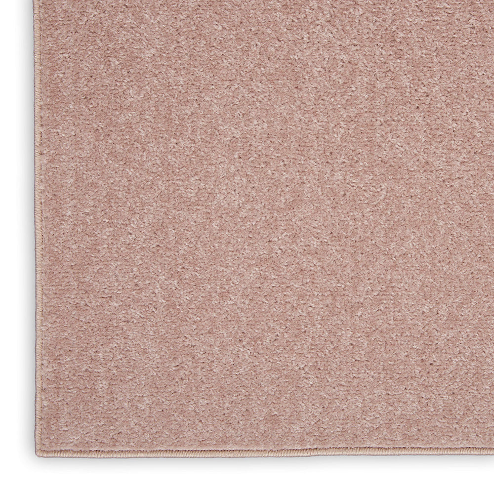 Nourison Essentials Pink Outdoor Rug showing low pile design