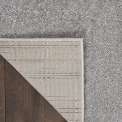 Nourison Essentials Silver Grey Outdoor Rug in living room setting