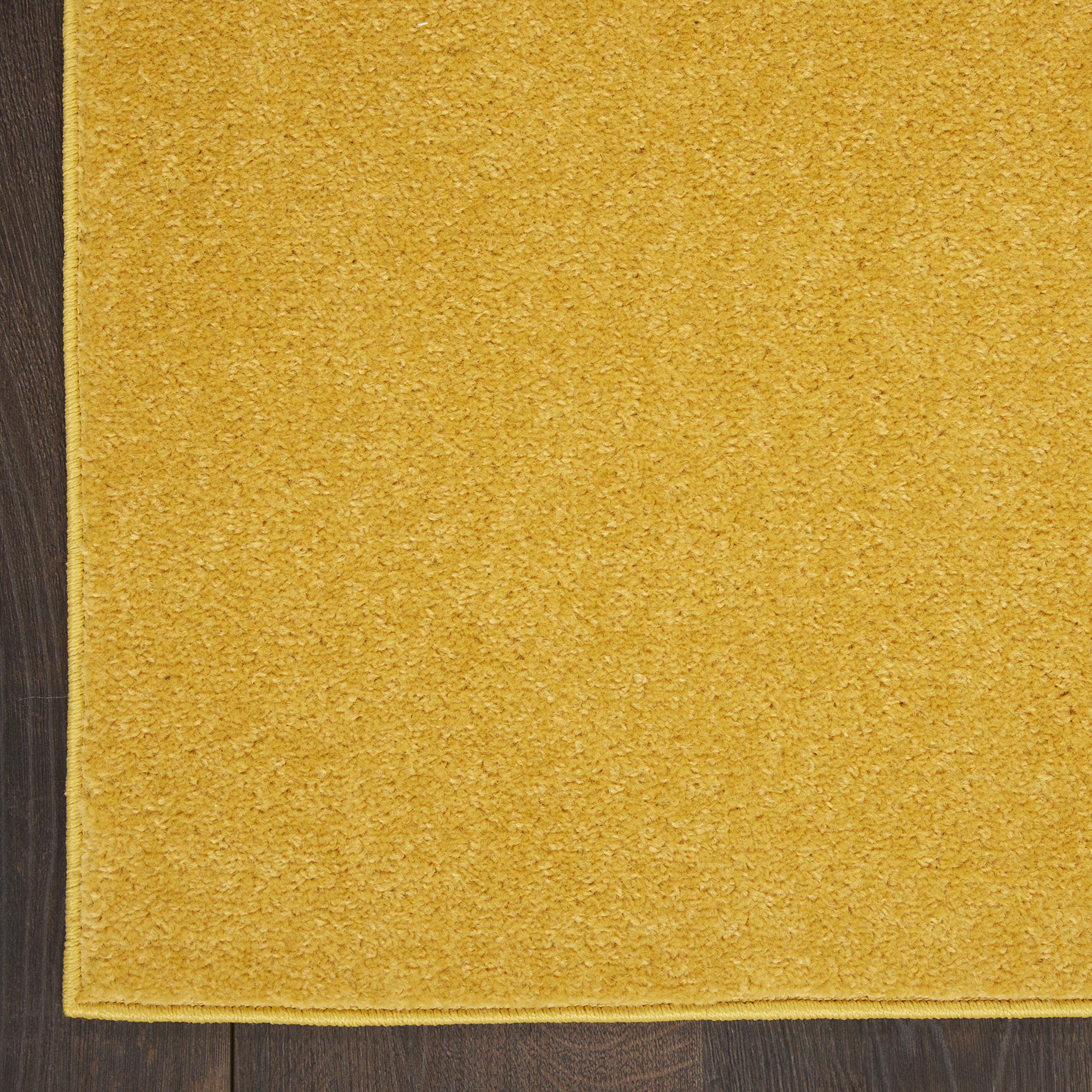 Nourison Essentials Yellow 2' x 4' Area Rug rolled up