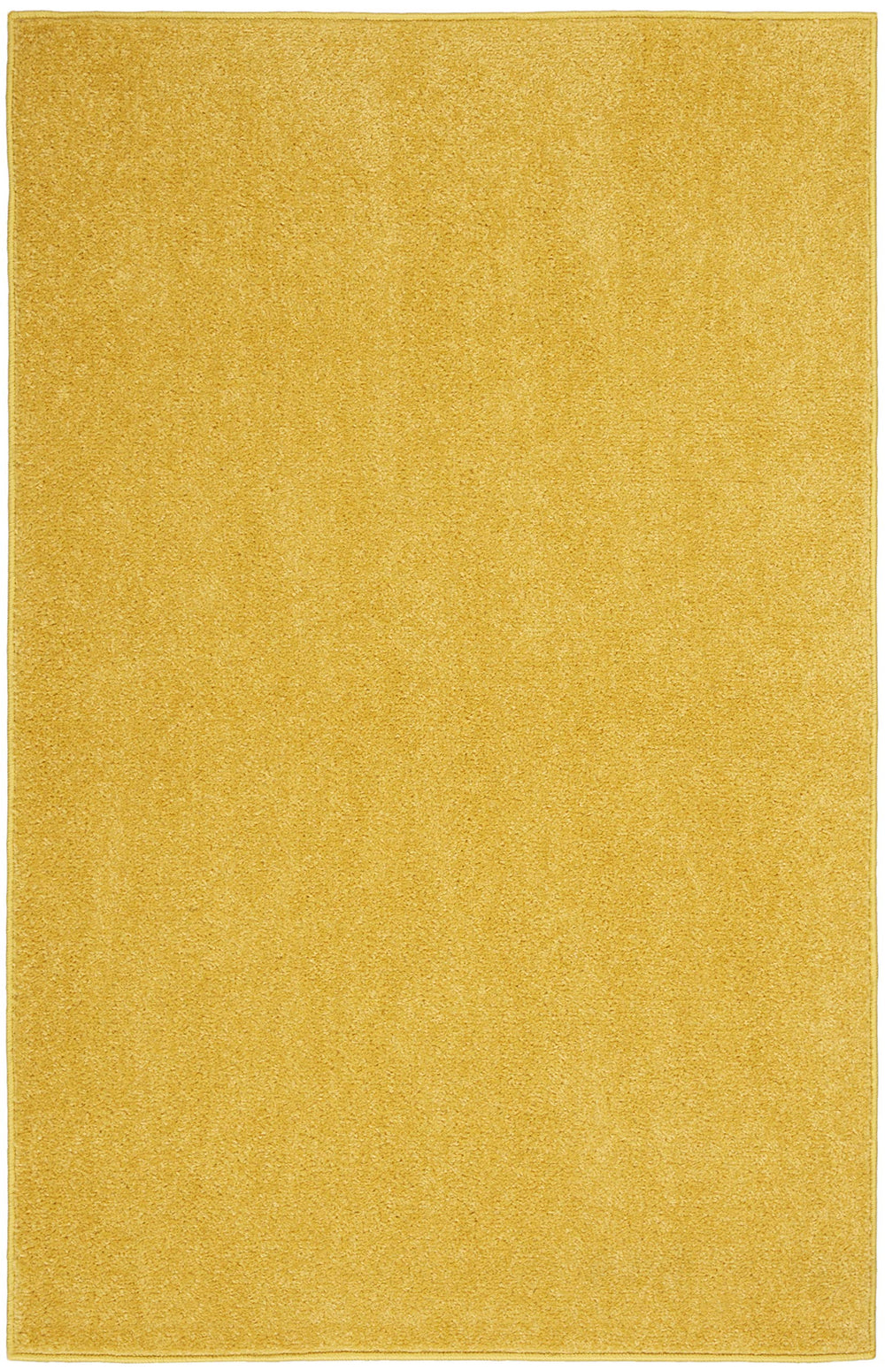 Nourison Essentials Yellow Area Rug in layered setup