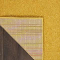 Nourison Essentials Yellow Area Rug in living room setting