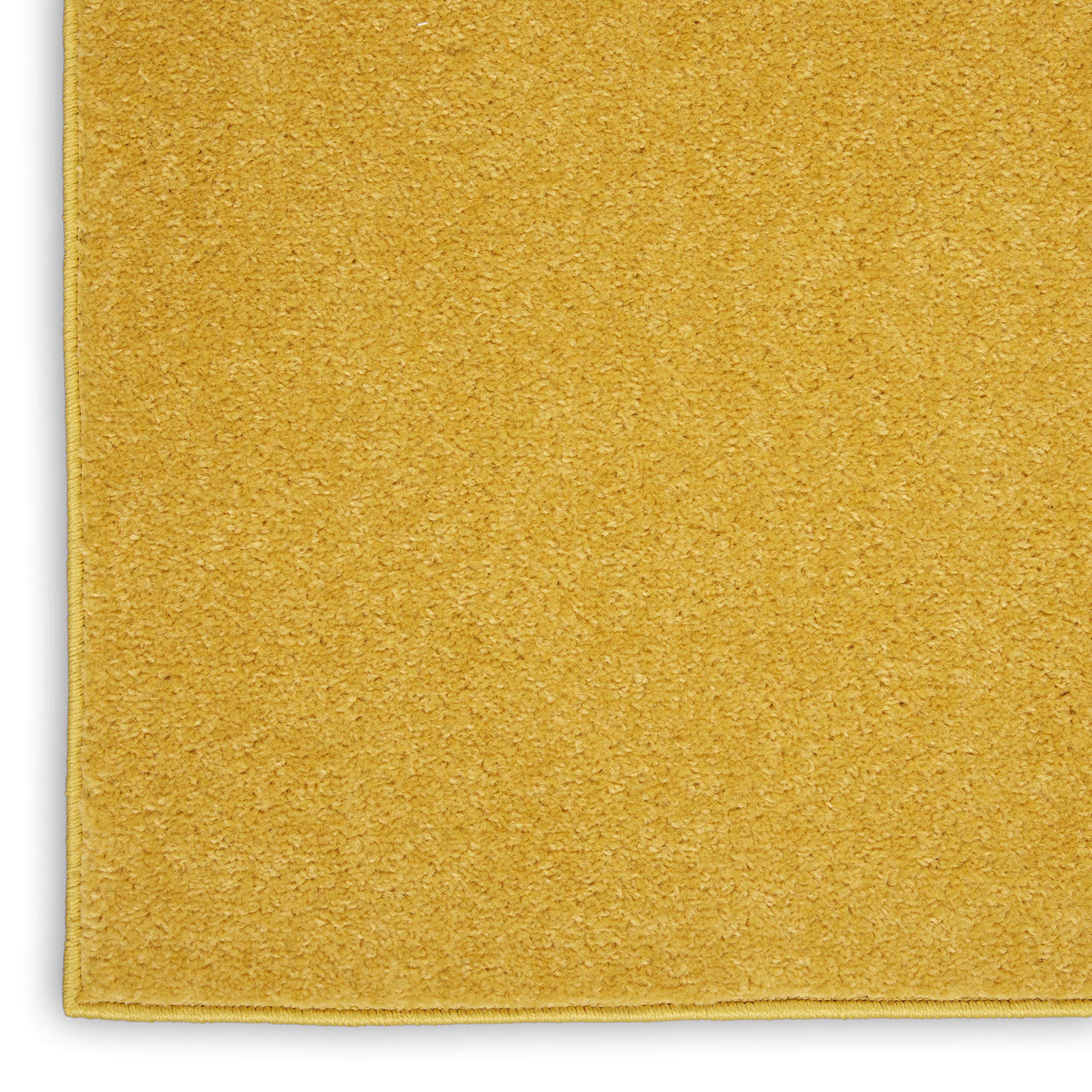 Nourison Essentials Yellow Area Rug near doorway