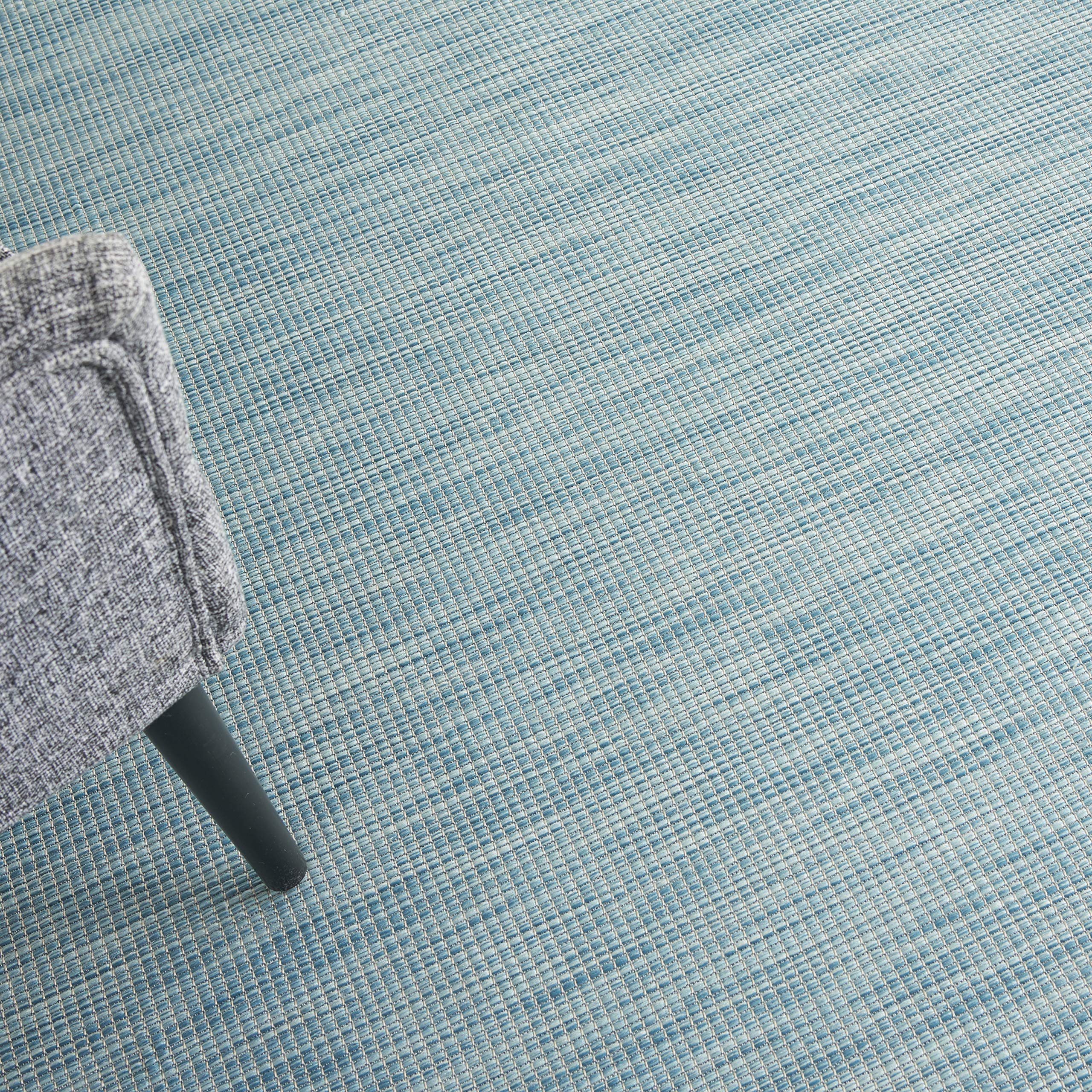 Nourison Positano Aqua outdoor rug in a living room setting