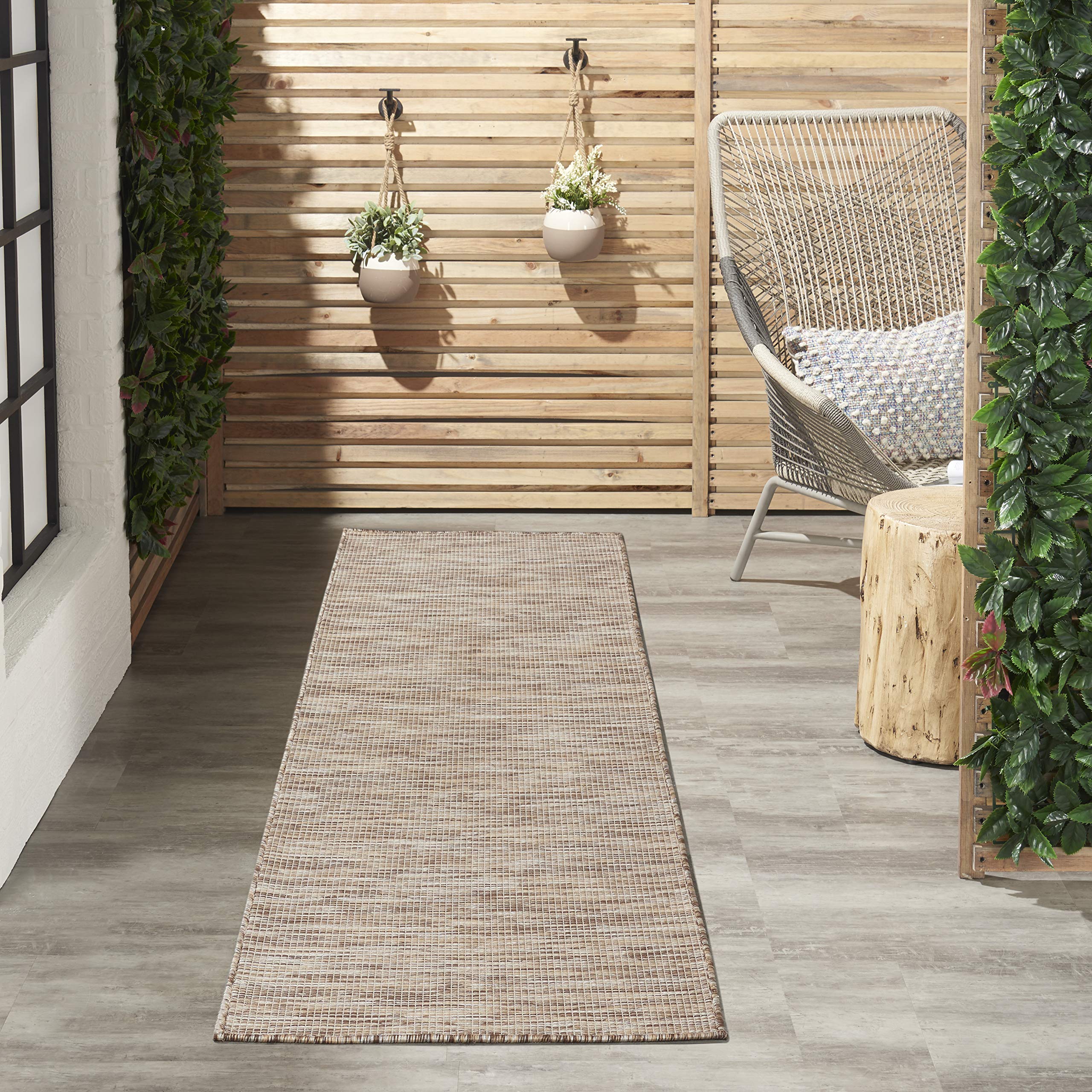 Nourison Positano Beige area rug rolled up for storage