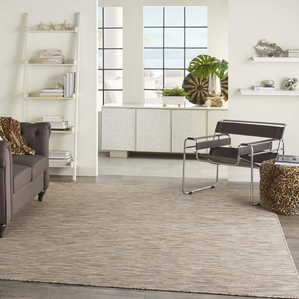Nourison Positano beige runner rug displayed on a patio