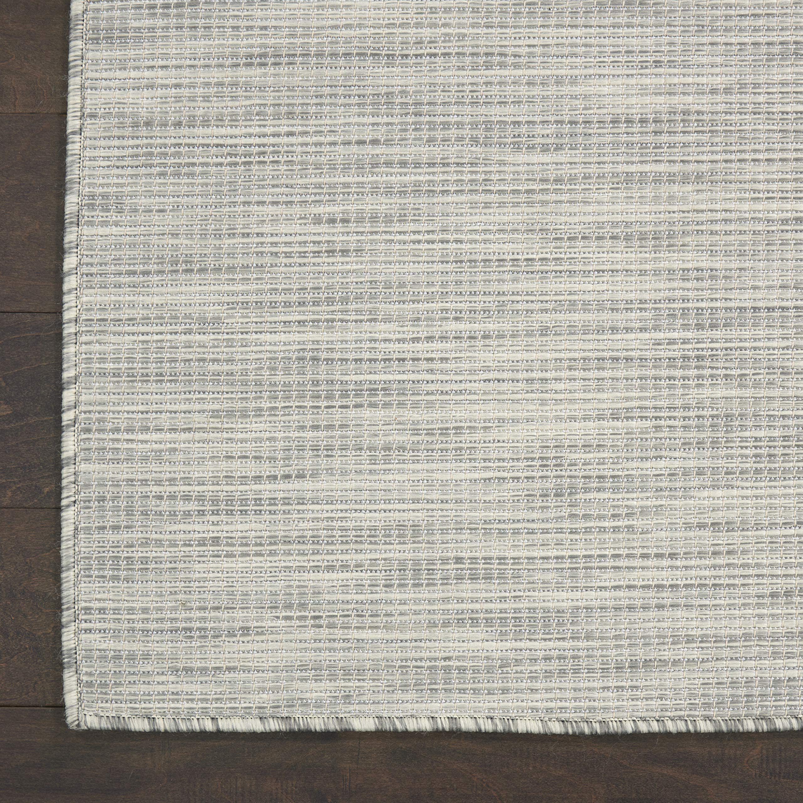Nourison Positano Light Grey rug on a deck