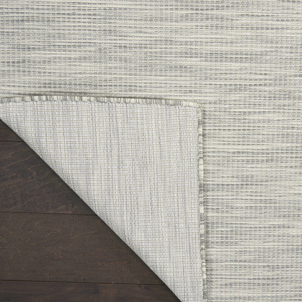 Nourison Positano Light Grey rug rolled up for storage