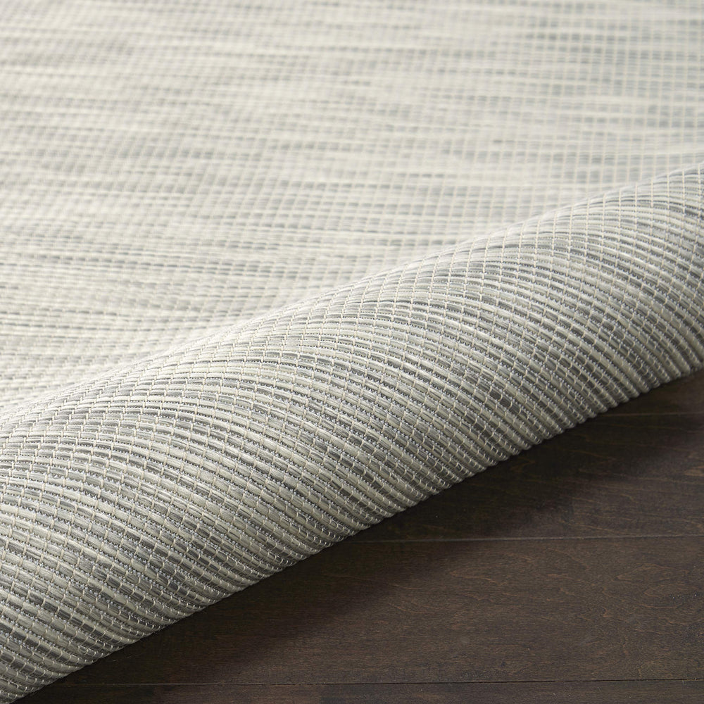 Nourison Positano Light Grey rug with patio furniture