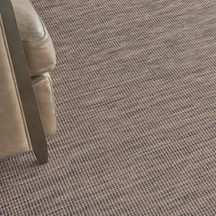 Nourison Positano Natural 2'2" x 12' outdoor rug in a patio setting