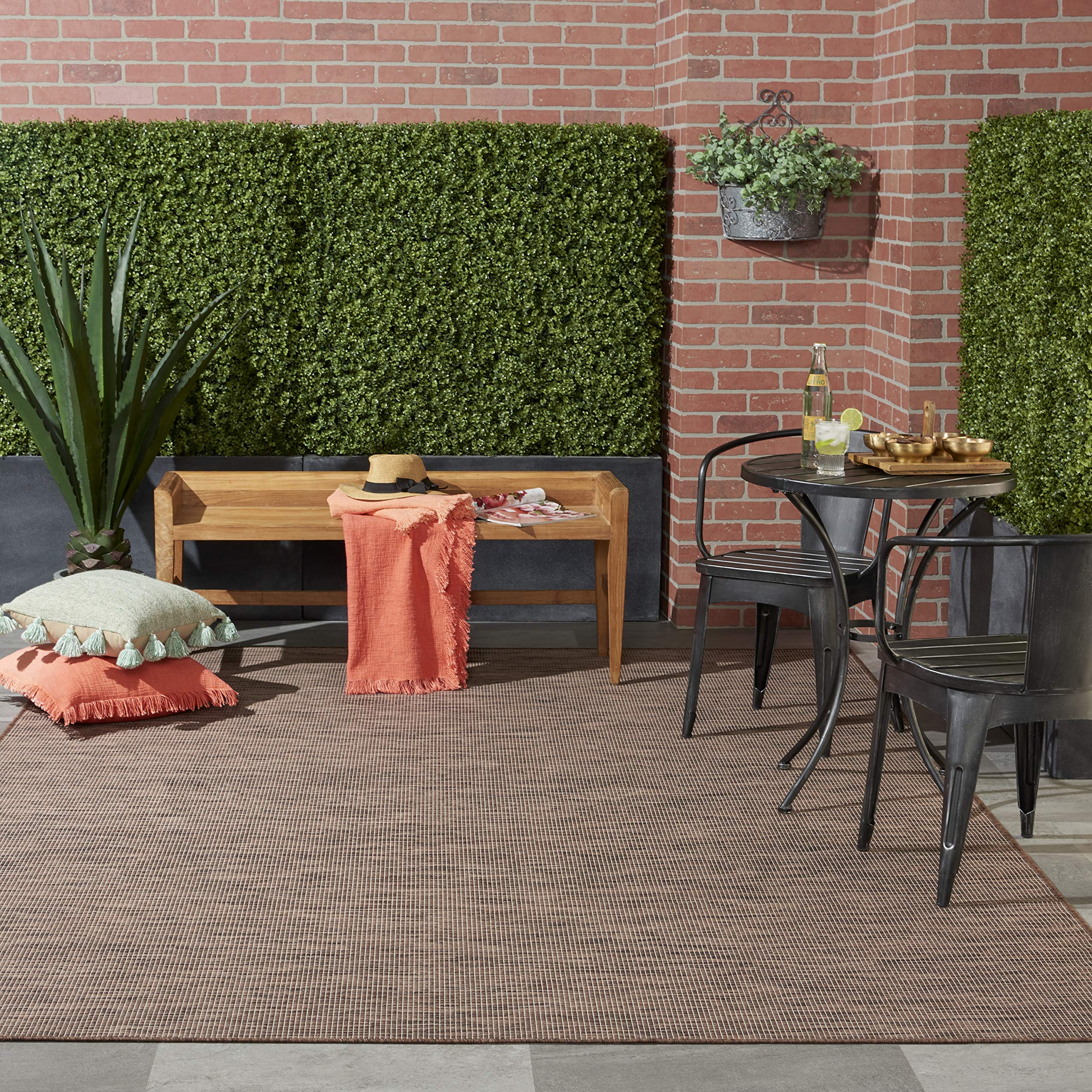 Nourison Positano Natural outdoor rug in a living room