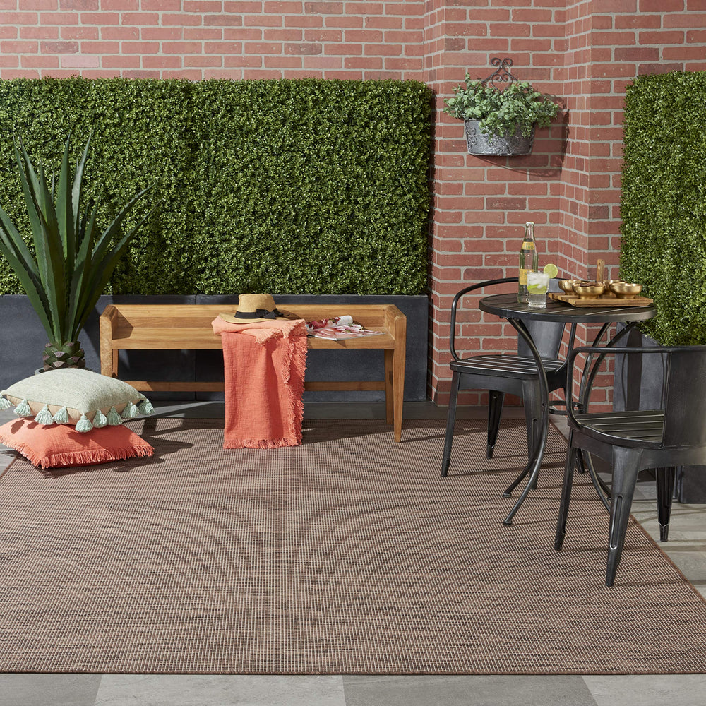 Nourison Positano Natural outdoor rug in a living room