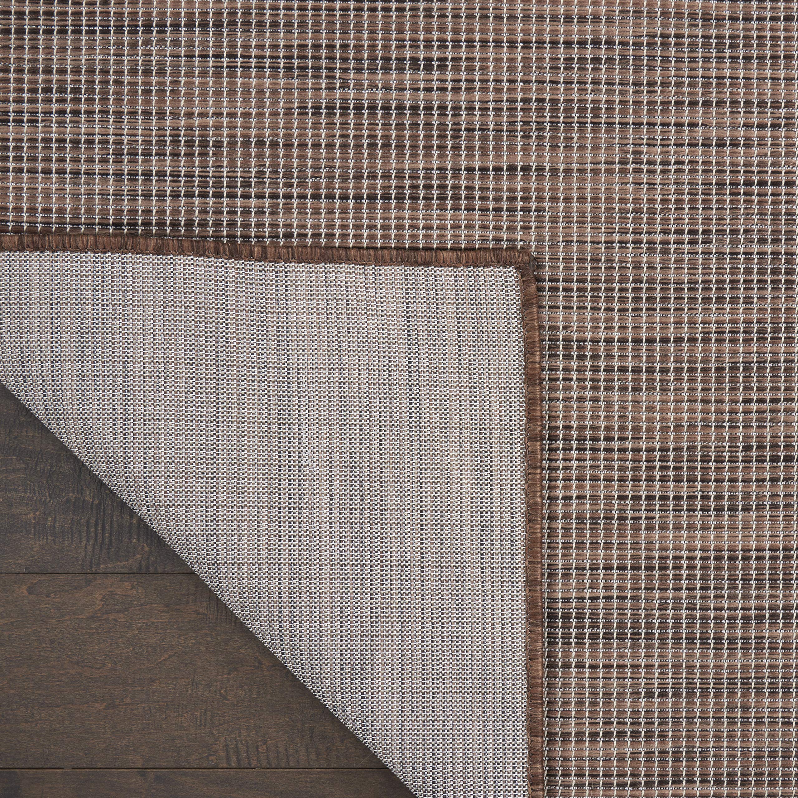 Nourison Positano Natural outdoor rug on a deck