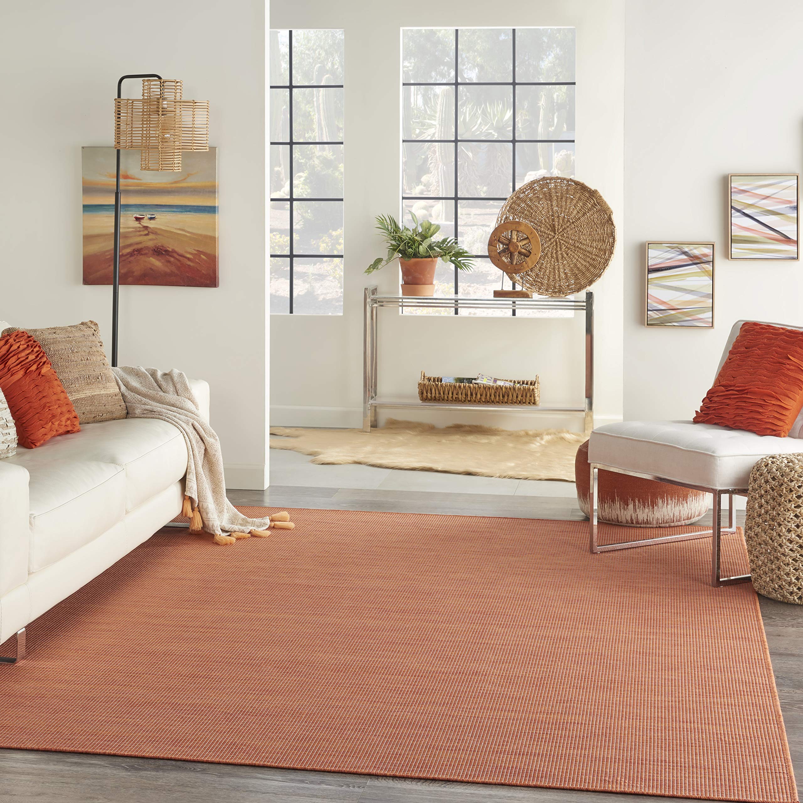 Nourison Positano Terracotta Outdoor Runner Rug in a patio setting