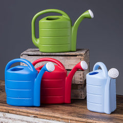 Novelty 2 Gallon Deluxe Watering Can in use watering plants