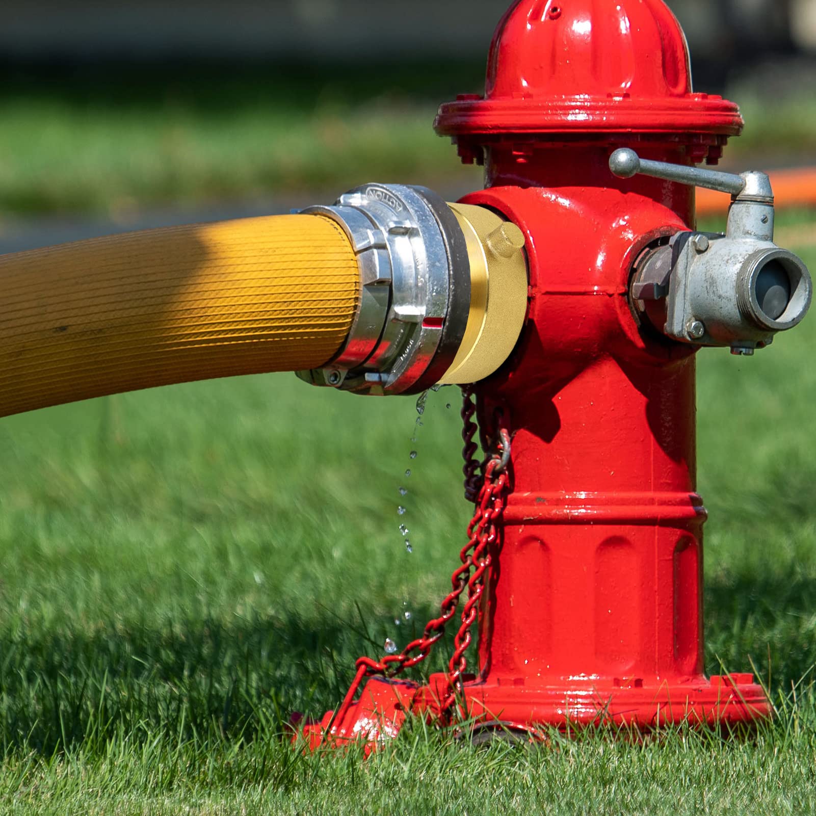 NOVINO Fire Hydrant Hose Adapter on a workbench showcasing its heavy-duty design