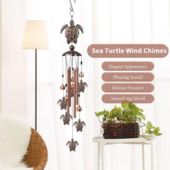 Nowpis Sea Turtle Wind Chime hanging in a garden setting