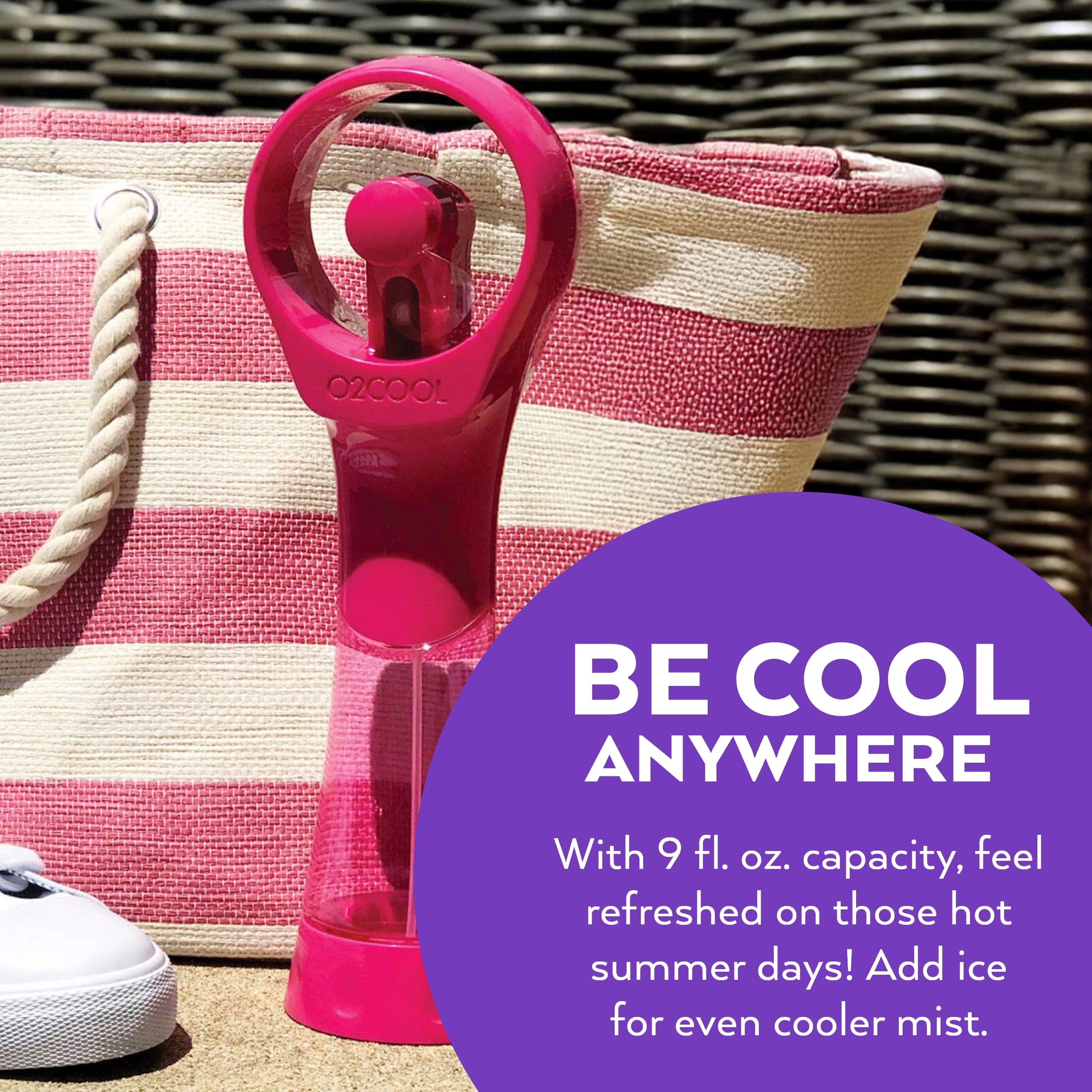 O2COOL handheld misting fan raspberry with user at the beach