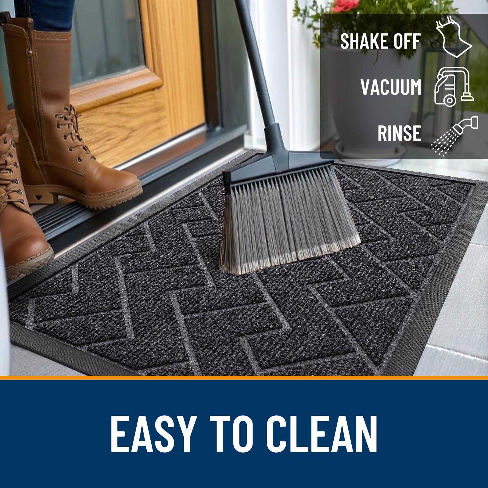 OLANLY doormat being cleaned with a garden hose