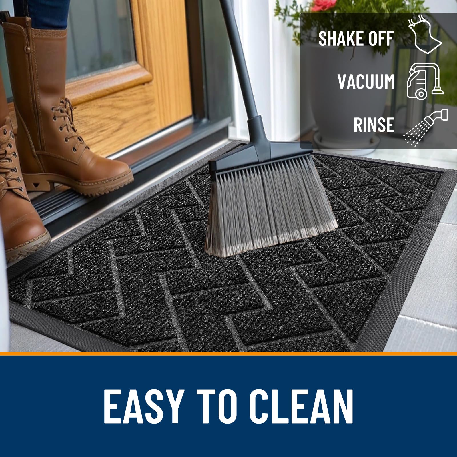 OLANLY doormat being cleaned with a garden hose