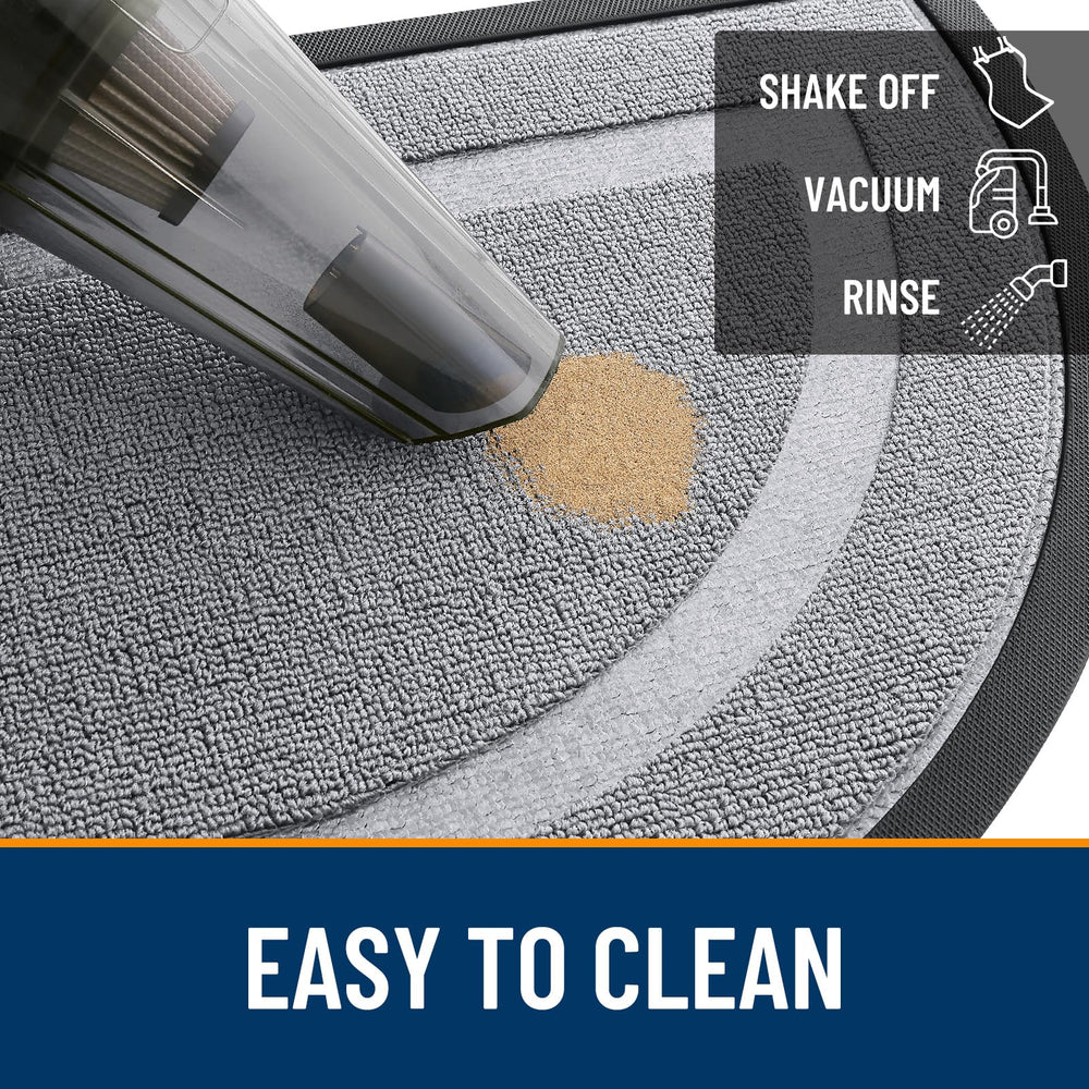 OLANLY doormat being cleaned with a hose