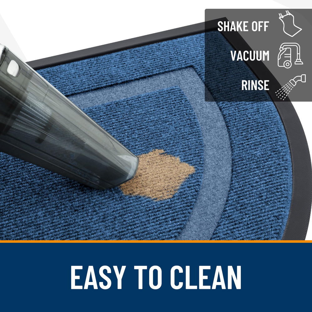 OLANLY Half Circle Door Mat being rinsed with a hose