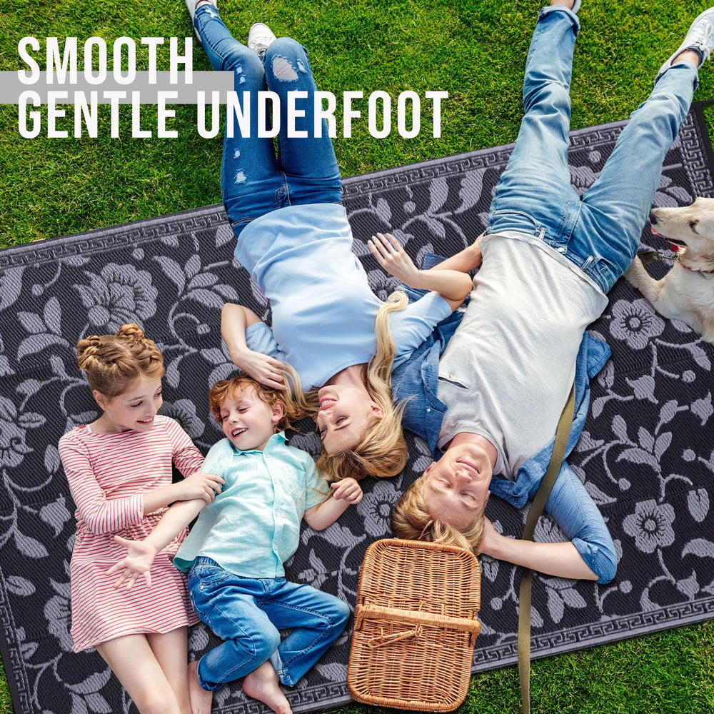 OLANLY outdoor rug in garden setting, showcasing black and grey colours