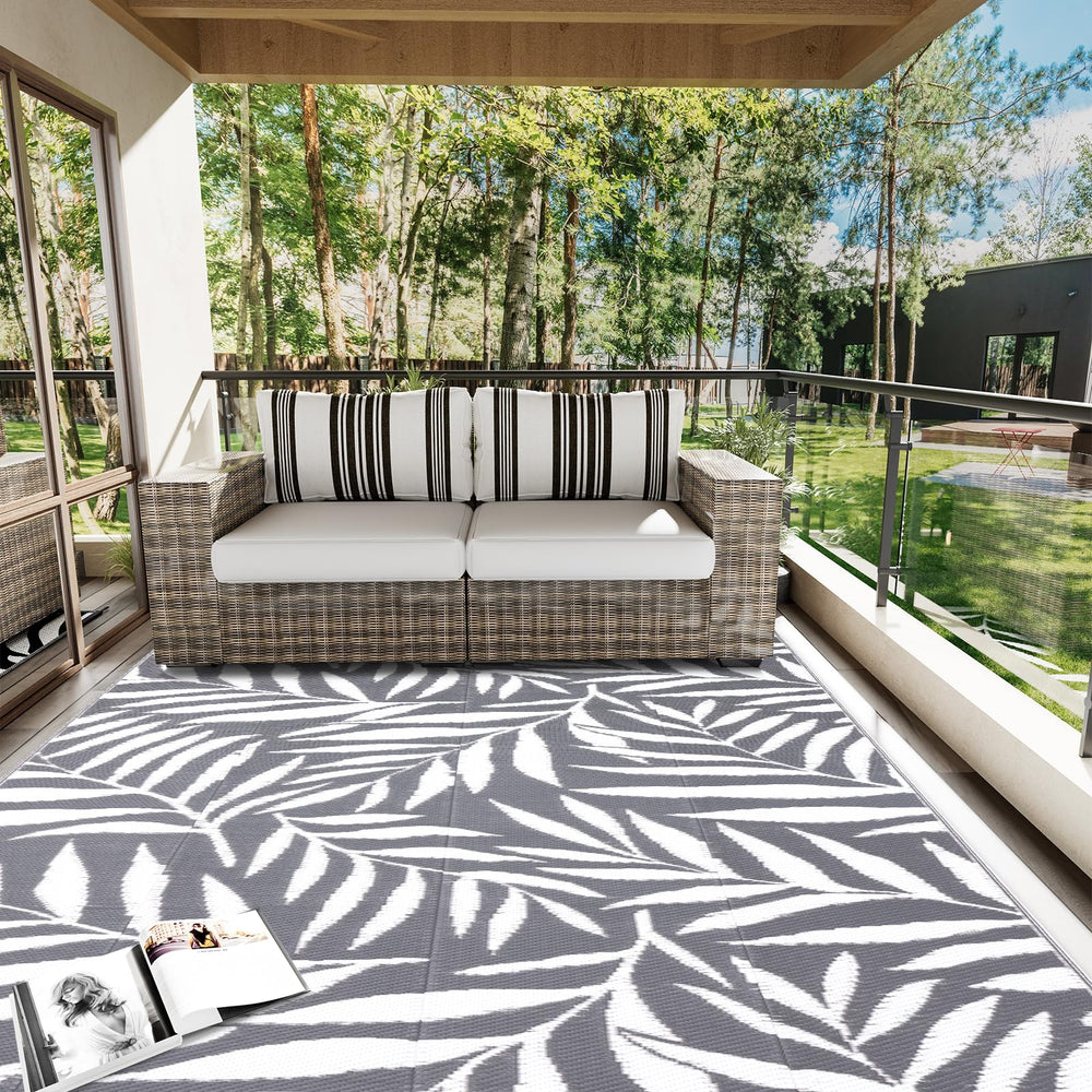 OLANLY Outdoor Rug secured with stakes on grass