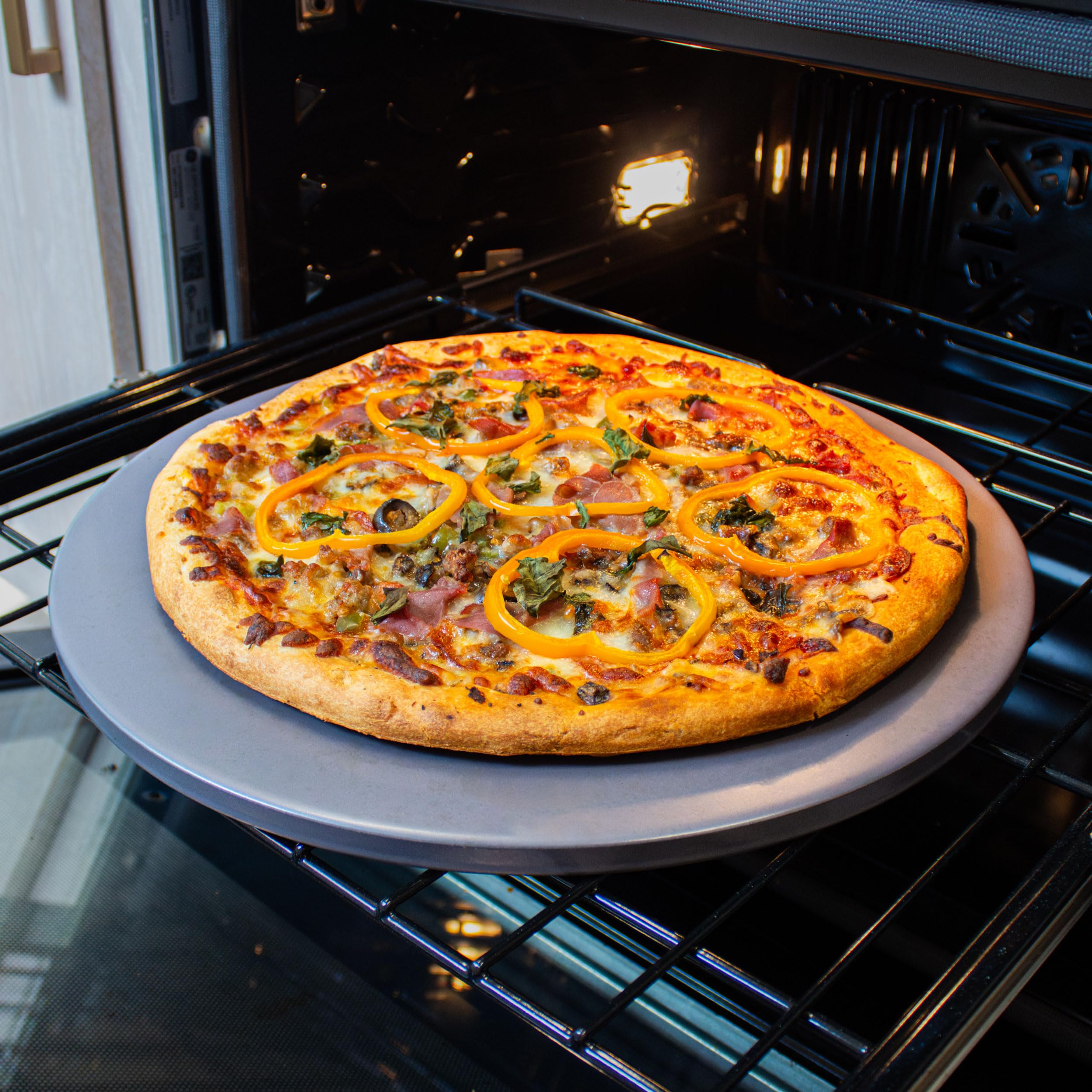 Old Stone pizza stone in use with homemade pizza