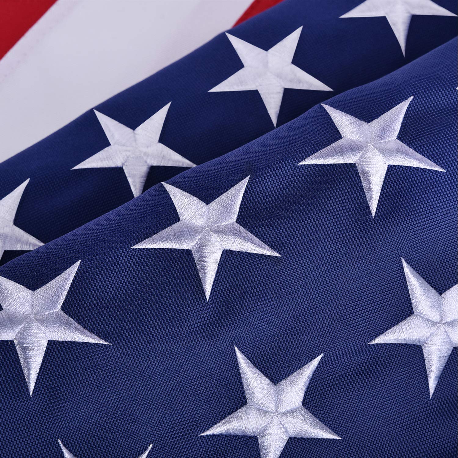 OLYNIK American Flag flying in outdoor setting