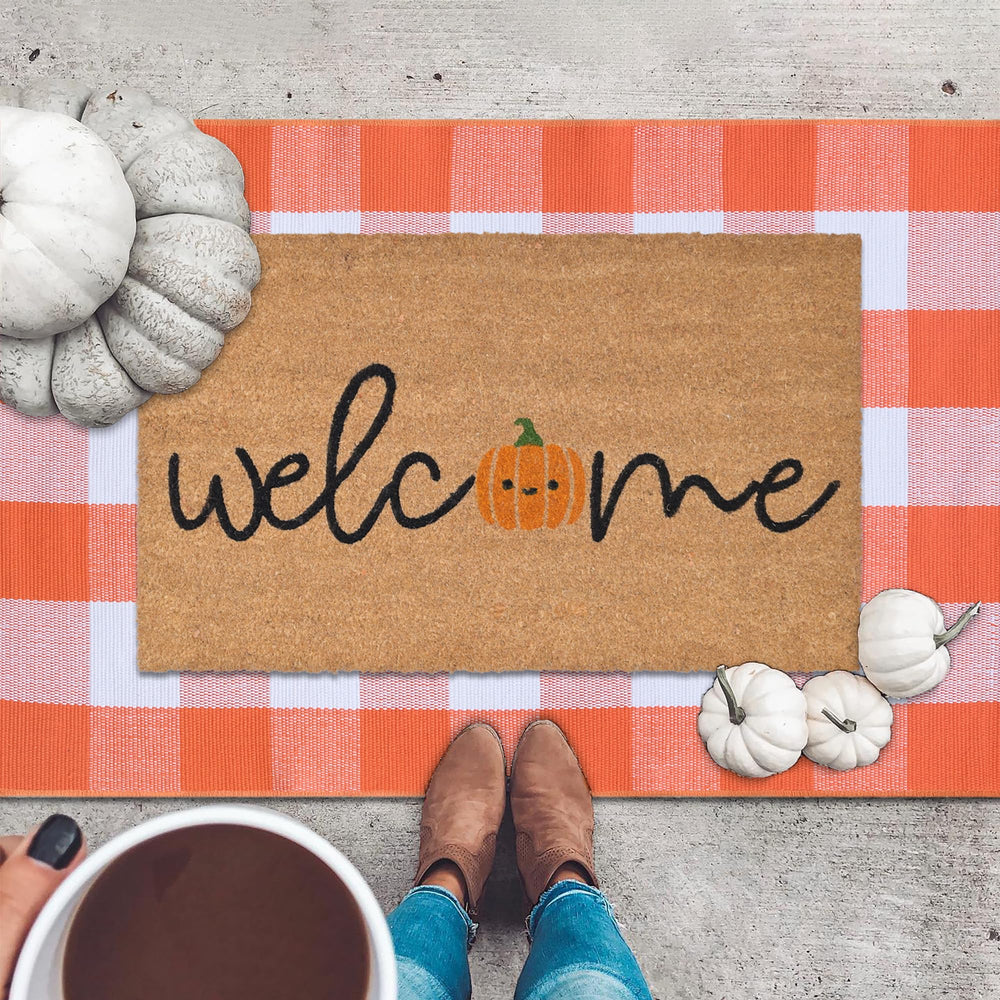Orange and white plaid rug measuring 28" x 43"