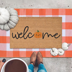 Orange and white plaid rug measuring 28" x 43"